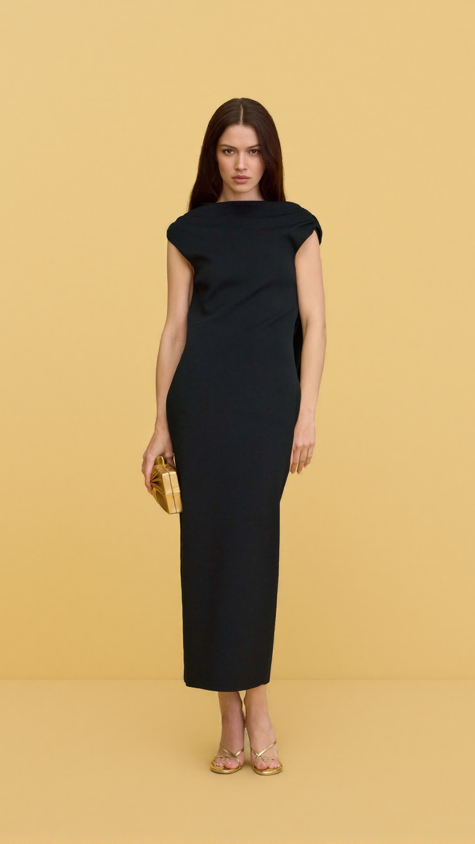 BLACK SLEEVELESS BACKLESS KNIT MIDI DRESS WITH TWO PLEATED GOLDEN EMBELLISHMENTS
