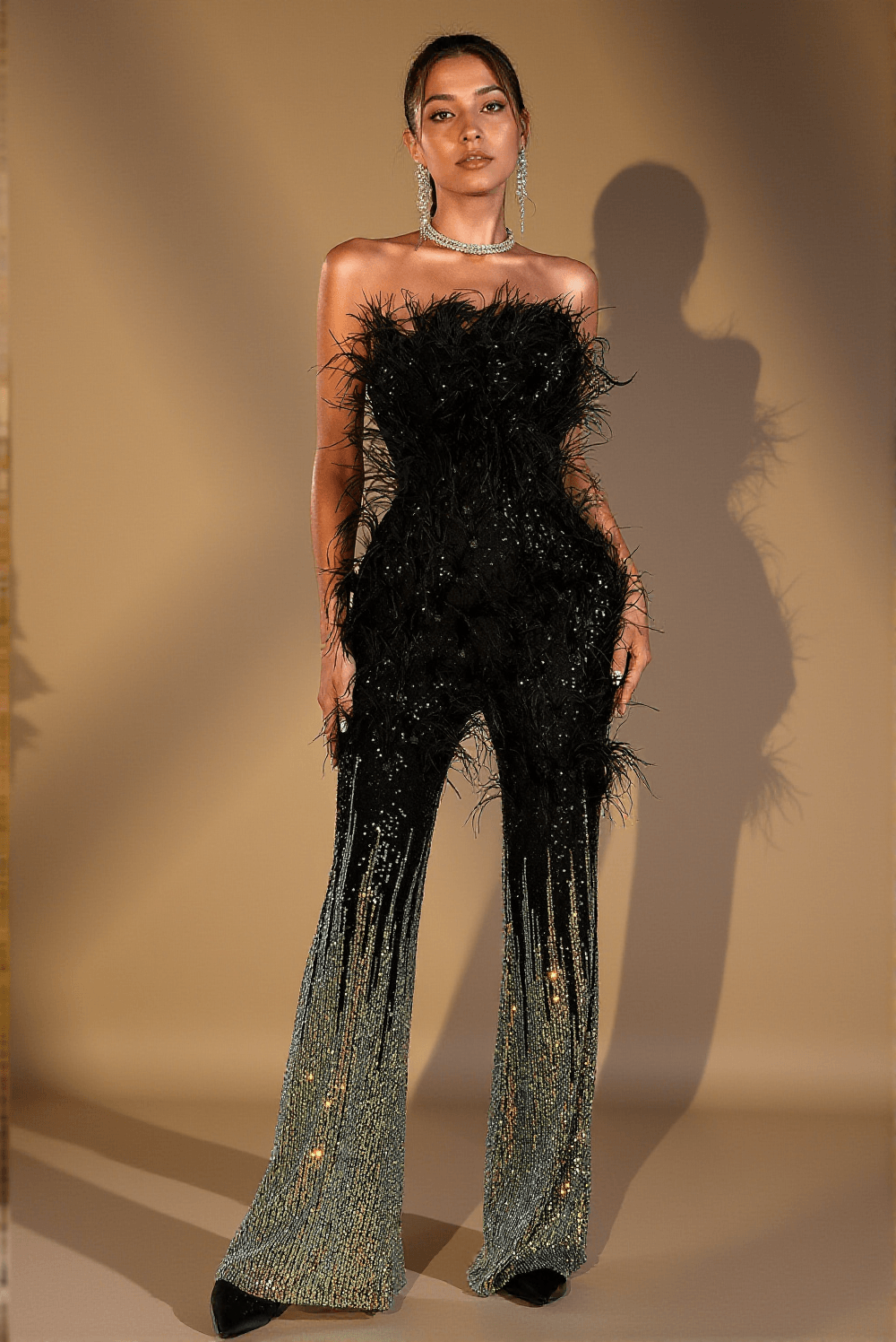 Tuta con paillettes e piume Damari