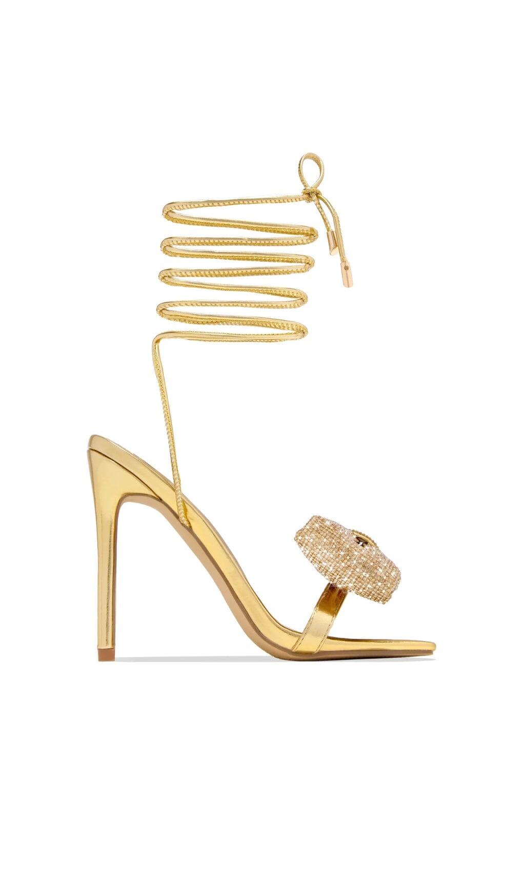 DÉCOLLETÉ CON FIOCCO E STRASS INCROCIATI IN ORO