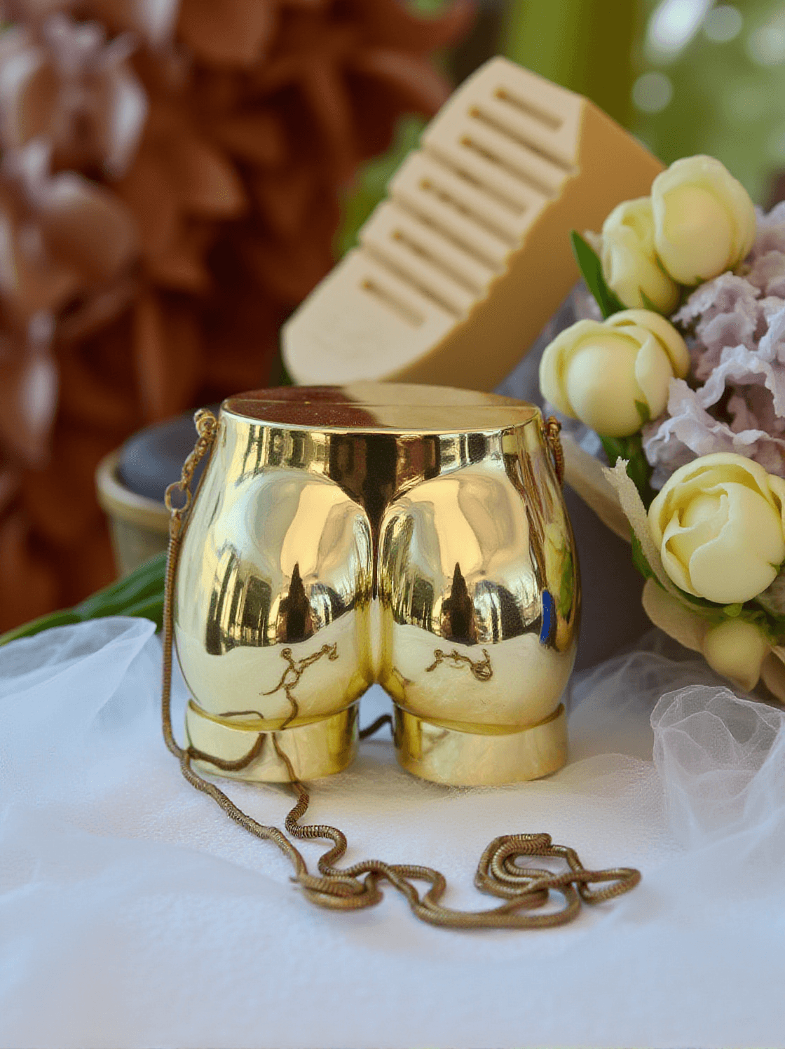 MORWENNA ACRYLIC BUTT BAG IN GOLD