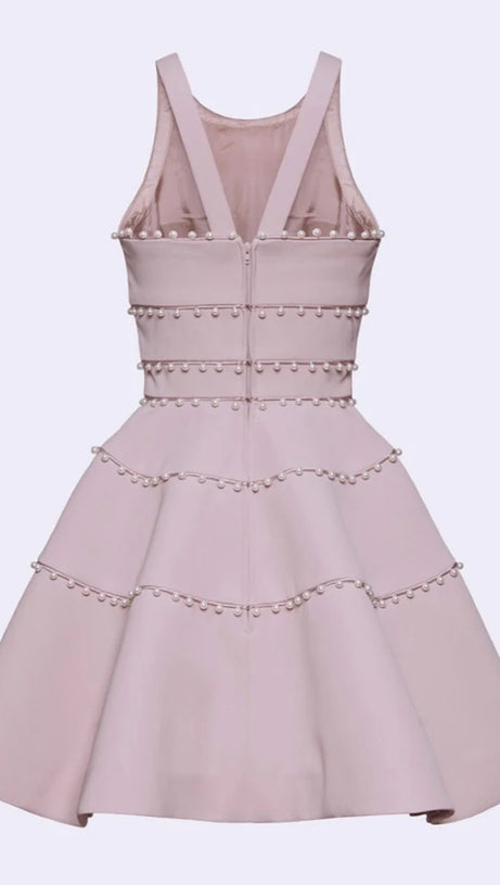 MINIABITO A TRAPEZIO CON DETTAGLIO DI PERLE IN ROSA