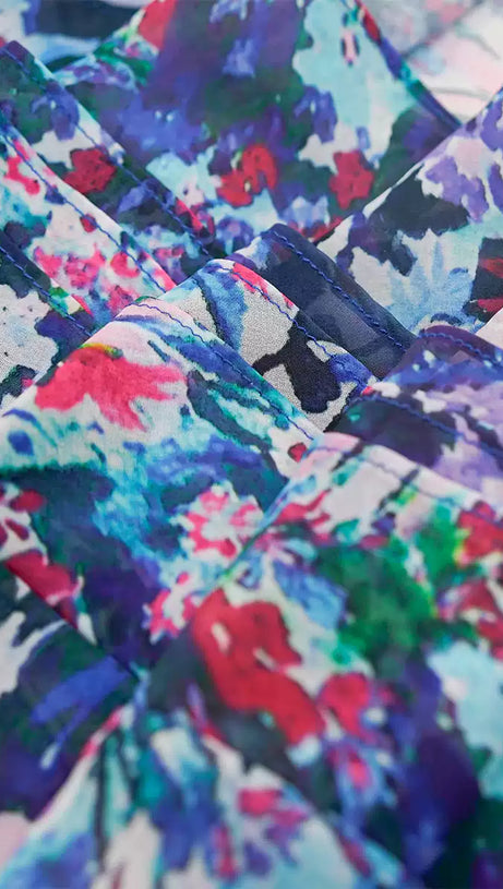 ELEGANT FLORAL MAXI DRESS WITH BOW NECKLINE AND RUFFLES