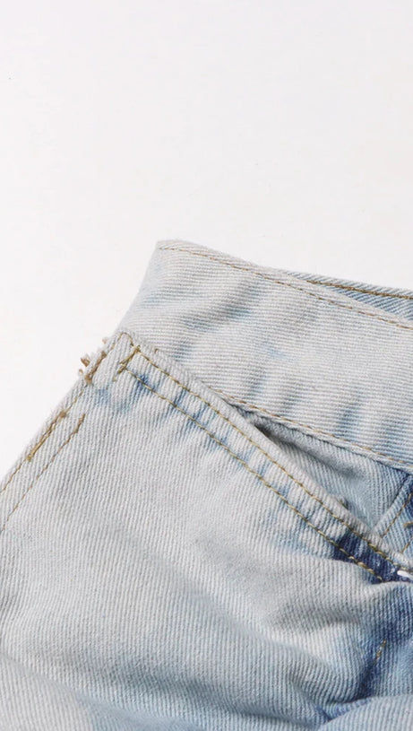 ERIN JEANSROCK MIT SAURE-WASH-RÜSCHEN