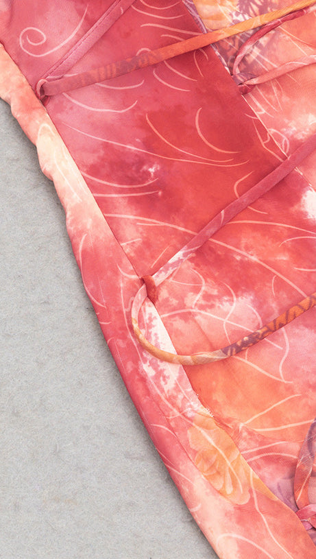 STRAPLESS PRINTED BODYCON KNOT MIDI DRESS