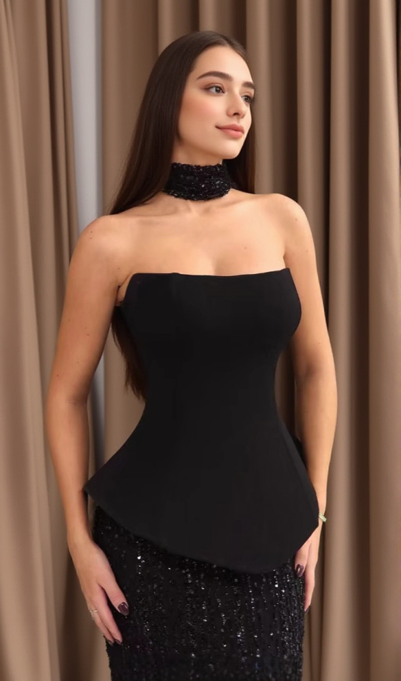 Black top and sequined floor-length skirt suit
