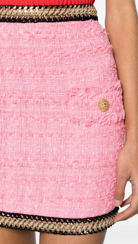 MINIGONNA IN TWEED ROSA CON DECORAZIONI A CATENA
