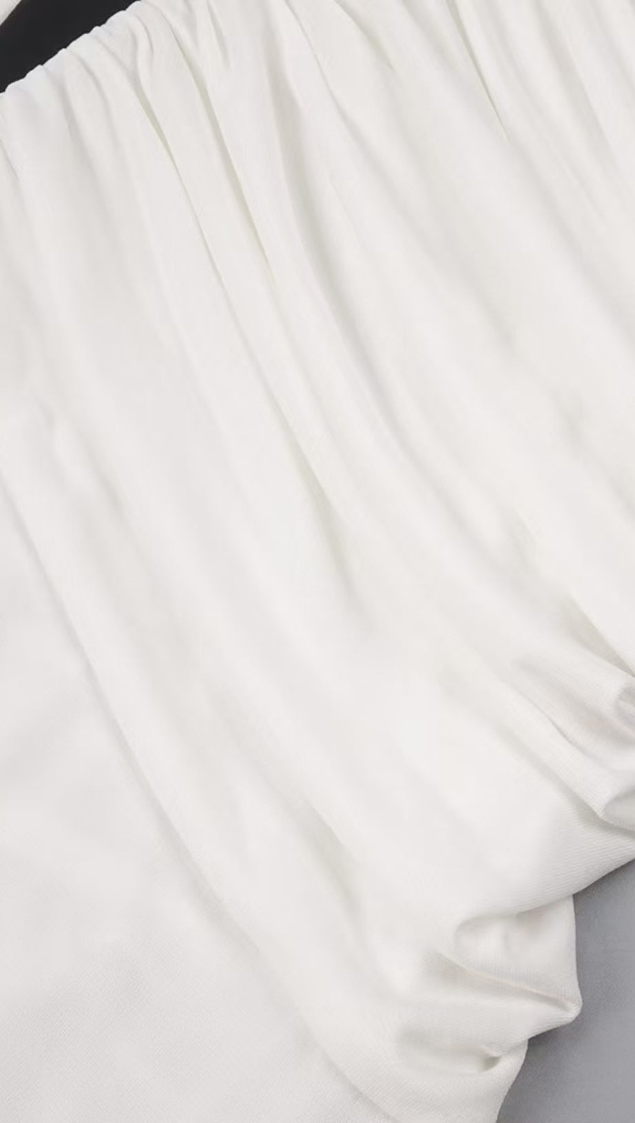 HIGH-CONTRAST HALTER MAXI GOWN WITH SCULPTURAL RUCHING