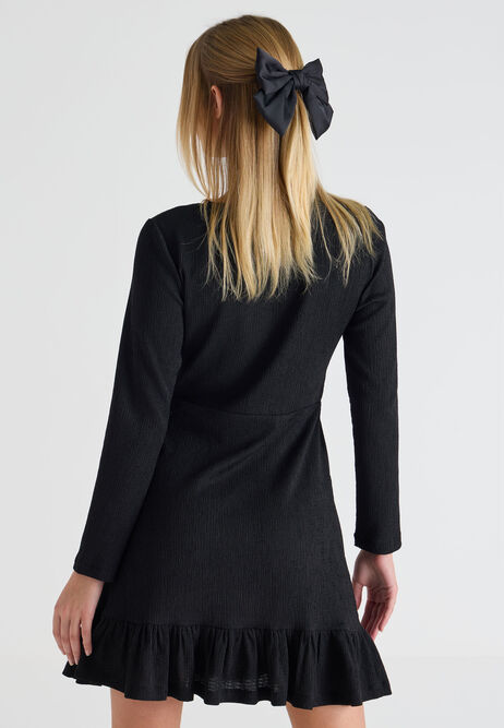 KNITTED SHEER FLARED MINI DRESS IN BLACK