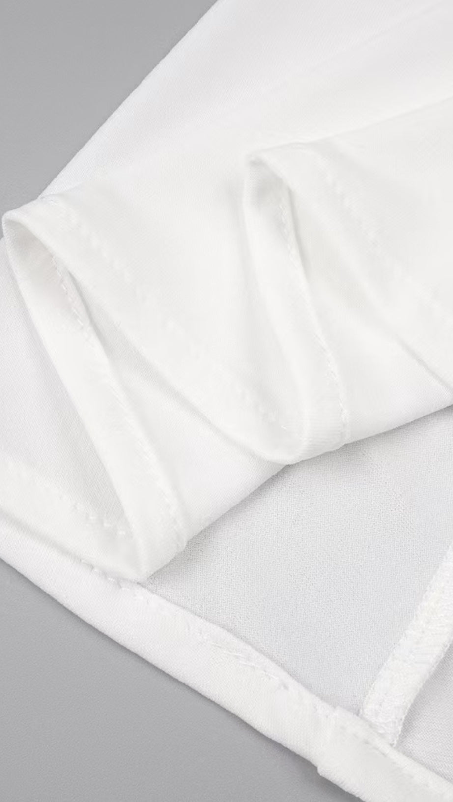 HIGH-CONTRAST HALTER MAXI GOWN WITH SCULPTURAL RUCHING