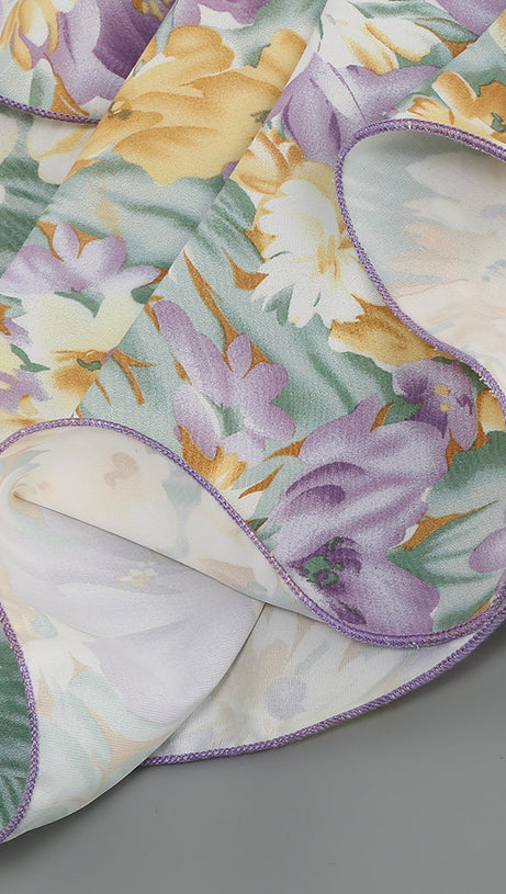 ABITO MIDI ASIMMETRICO CON MANICA MONOSPALLA E VOLANT