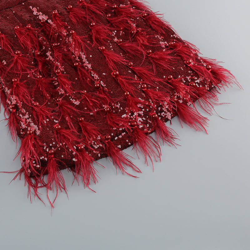 MINI ABITO MONOSPALLA CON PIUME E PAILLETTES