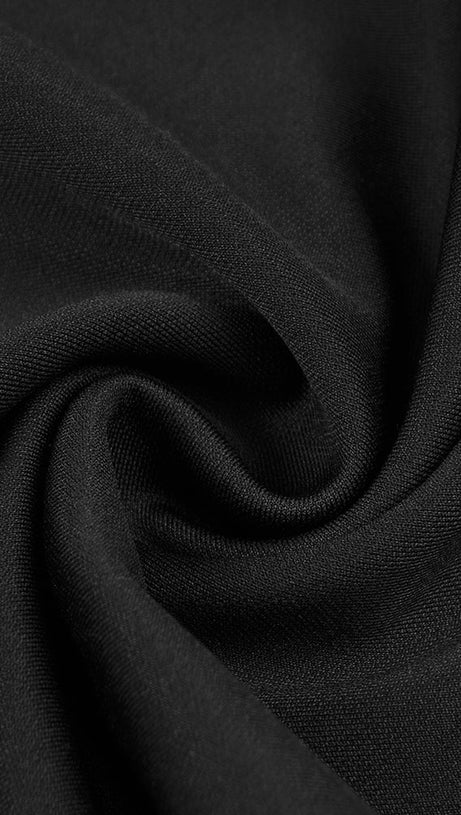 LANGÄRMELIGER JUMPSUIT MIT PAILLETTEN UND FEDERN IN SCHWARZ