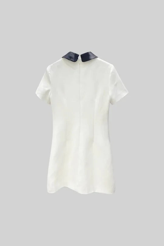 DRESS WITH CONTRASTING COLLAR AND JEWELRY DETAILS