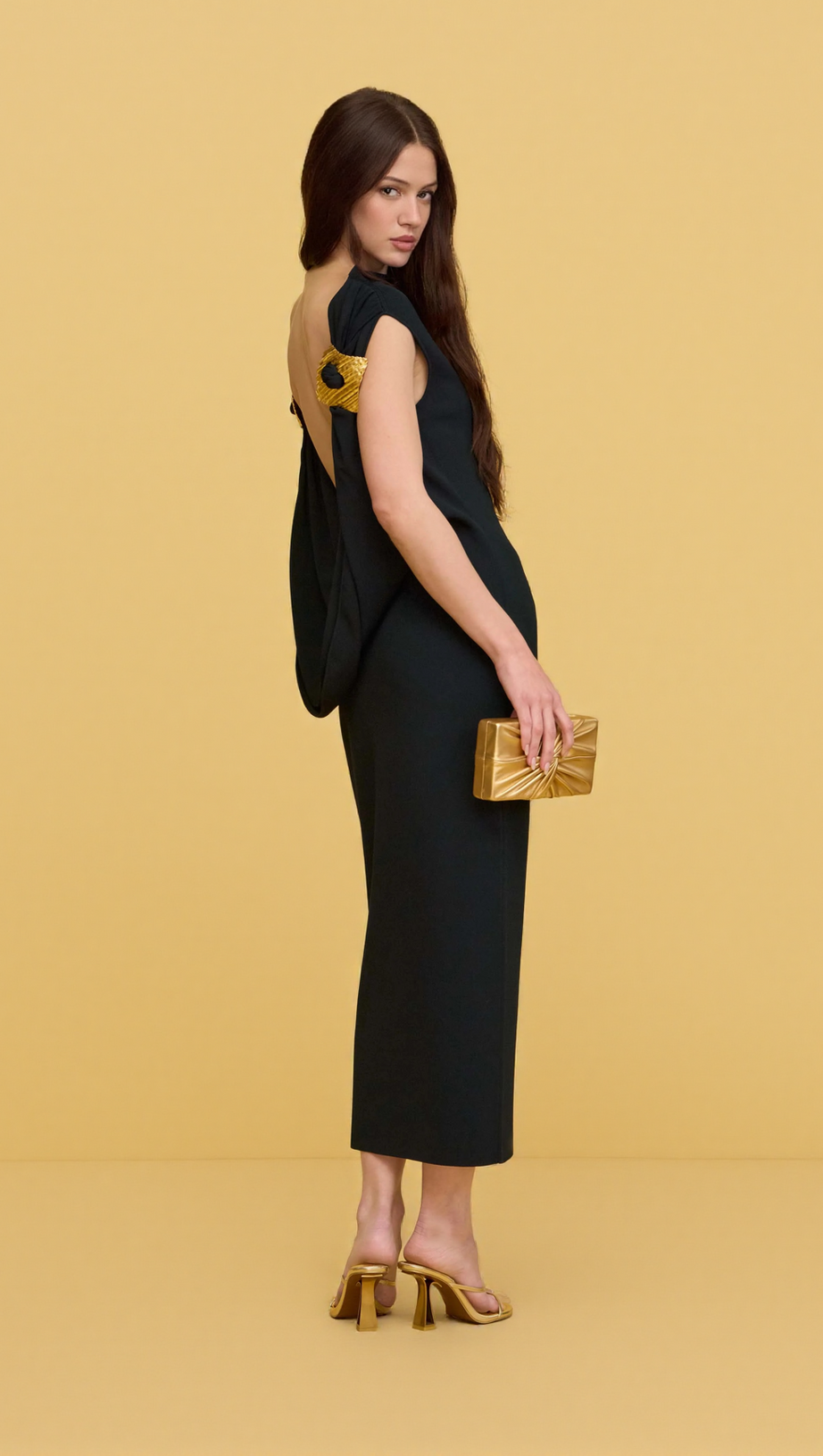 BLACK SLEEVELESS BACKLESS KNIT MIDI DRESS WITH TWO PLEATED GOLDEN EMBELLISHMENTS