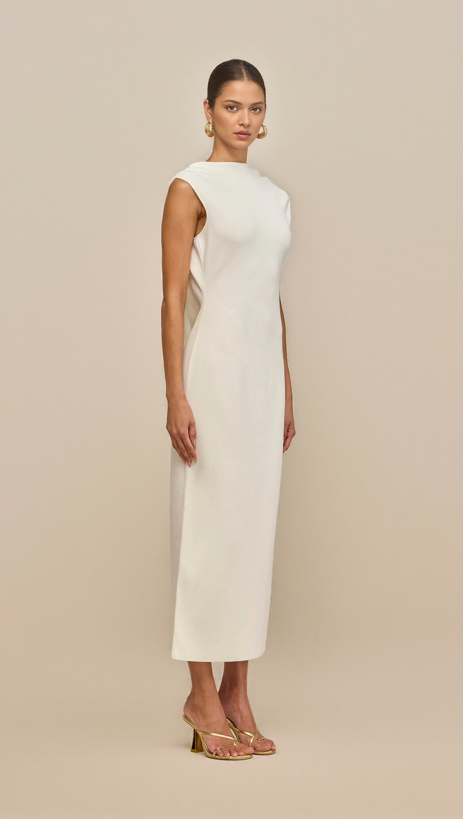 WHITE SLEEVELESS BACKLESS KNIT MIDI DRESS WITH TWO PLEATED GOLDEN EMBELLISHMENTS