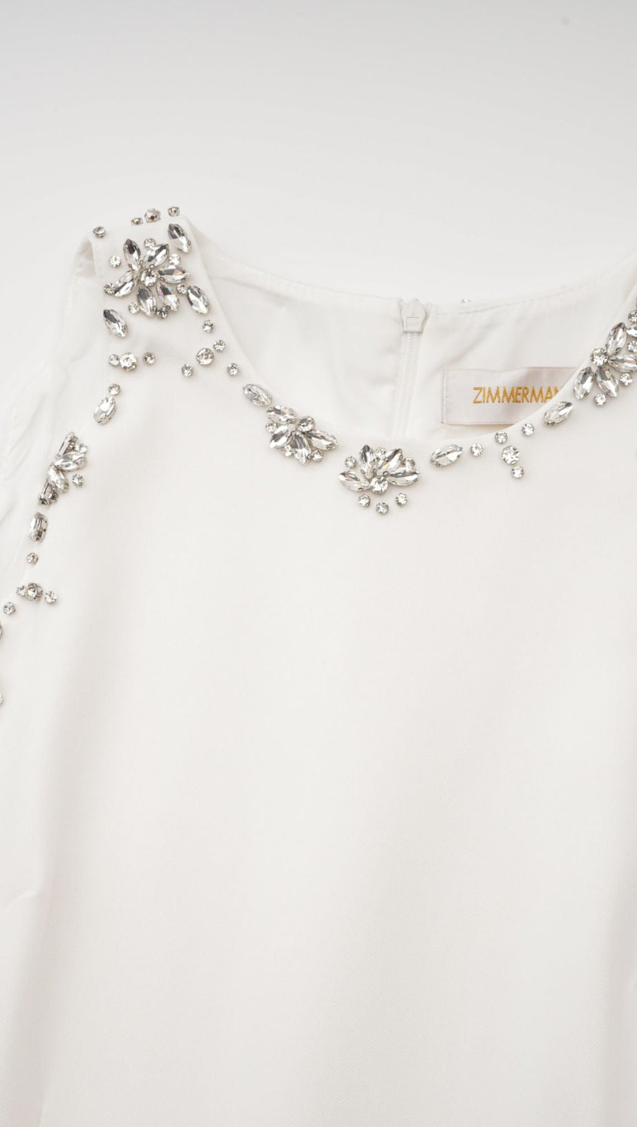 MINI ABITO BIANCO CON DETTAGLIO DI FIOCCO DI CRISTALLI