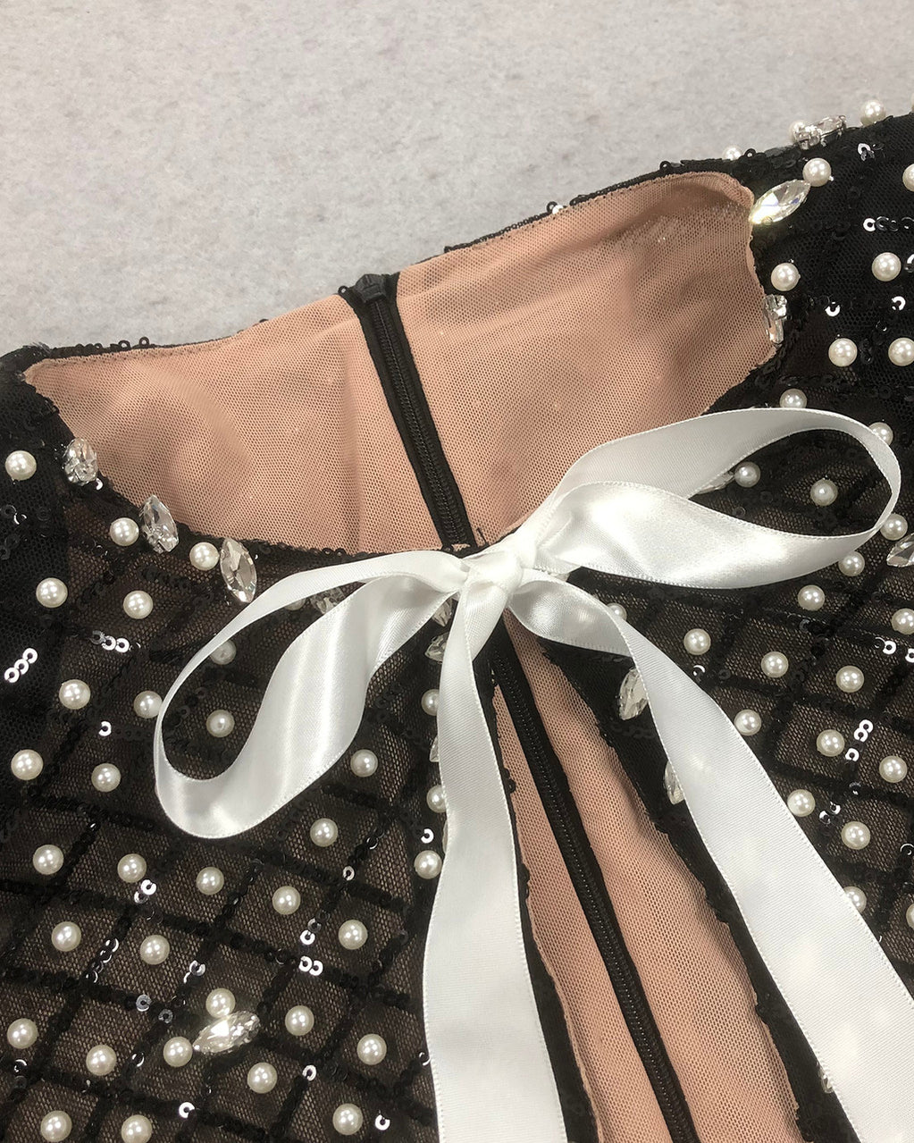 PEARL EMBELLISHED CUT OUT BOW MINI DRESS IN BLACK