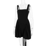 BACKLESS BOW MINI DRESS IN BLACK