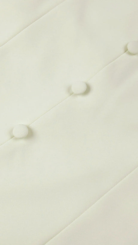 ABITO LUNGO IN TESSUTO A MANDORLA CON BOTTONI A TRIANGOLO