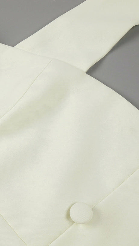 ABITO LUNGO IN TESSUTO A MANDORLA CON BOTTONI A TRIANGOLO