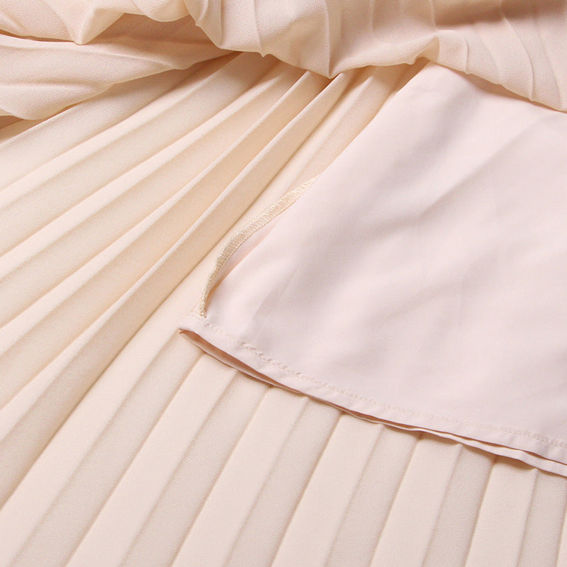 ÄRMELLOSES MIDIKLEID AUS STRICK MIT FÄLLEN IN APRICOT