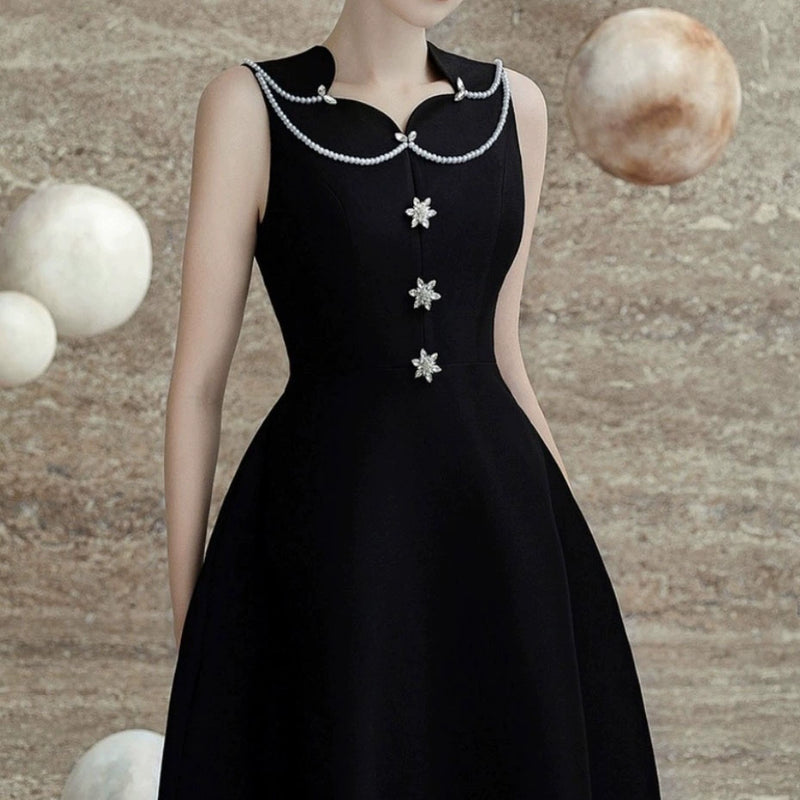 PEARL EMBELLISHED A LINE MIDI DRESS IN BLACK