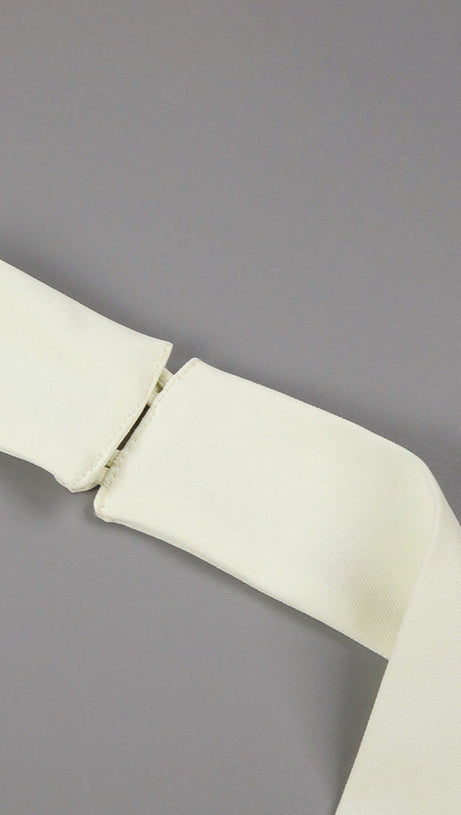 ABITO LUNGO IN TESSUTO A MANDORLA CON BOTTONI A TRIANGOLO