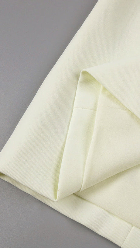 ABITO LUNGO IN TESSUTO A MANDORLA CON BOTTONI A TRIANGOLO