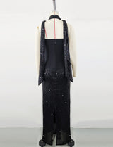 Black top and sequined floor-length skirt suit