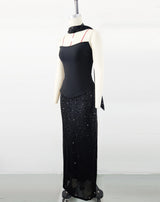 Black top and sequined floor-length skirt suit