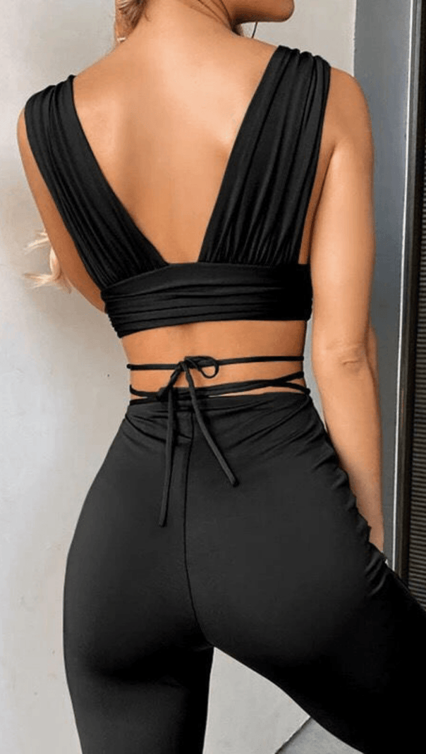 OPEN-BACK TOP AND HIGH-WAISTED BOOTCUT TROUSERS.