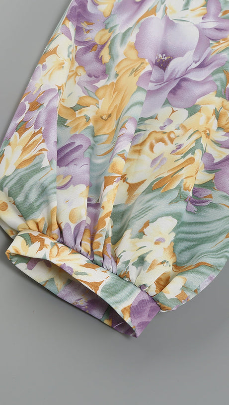 ABITO MIDI ASIMMETRICO CON MANICA MONOSPALLA E VOLANT