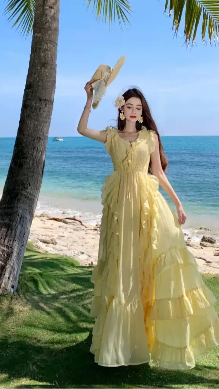 Abito lungo giallo con volant 