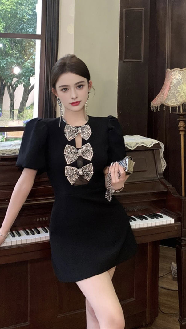 AIIZIE VANESSA BOW PUFF SLEEVE MINI DRESS IN BLACK - product image
