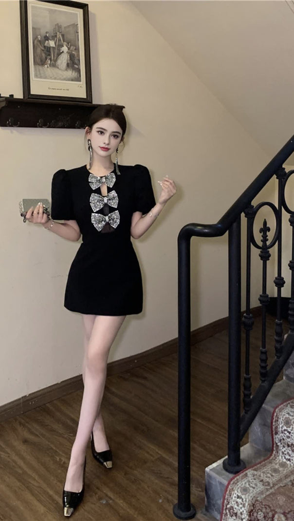 AIIZIE VANESSA BOW PUFF SLEEVE MINI DRESS IN BLACK - product image
