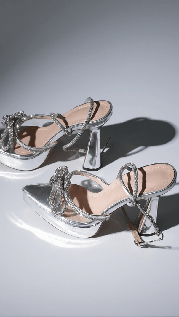 AIIZIE ANOUK BOW CRYSTAL HEELS IN SILVER - product image