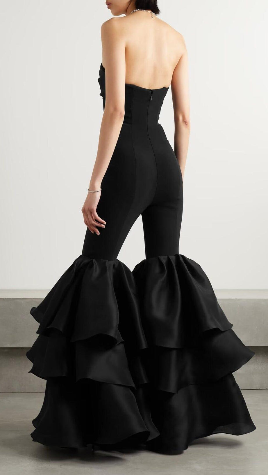 BLACK STRAPLESS JUMPSUIT WITH TIERED RUFFLE HEM