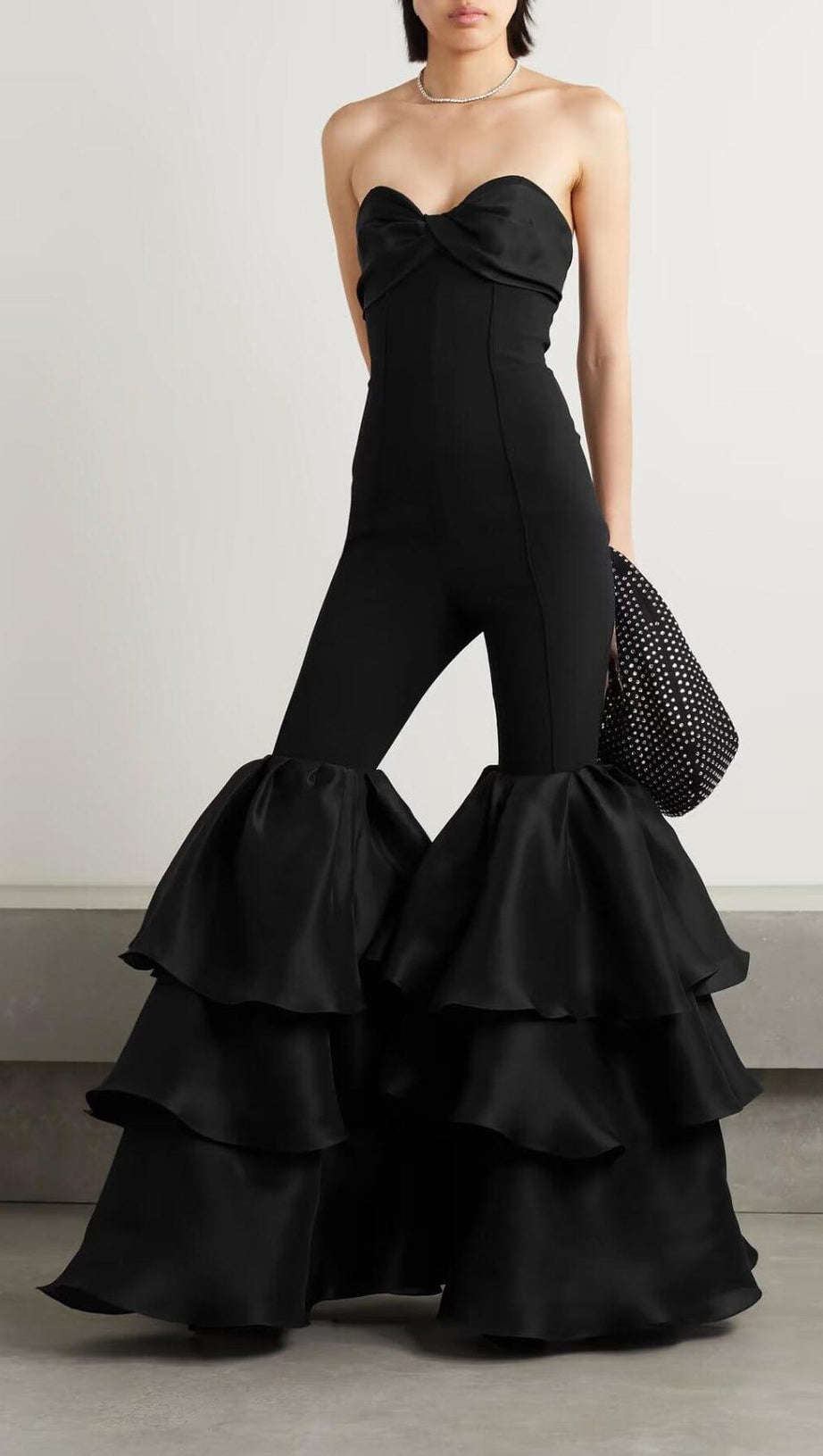 BLACK STRAPLESS JUMPSUIT WITH TIERED RUFFLE HEM