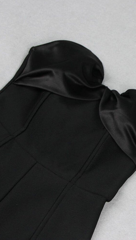 BLACK STRAPLESS JUMPSUIT WITH TIERED RUFFLE HEM