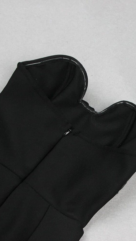 BLACK STRAPLESS JUMPSUIT WITH TIERED RUFFLE HEM