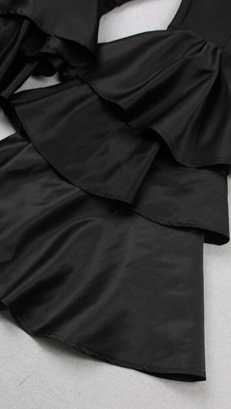 BLACK STRAPLESS JUMPSUIT WITH TIERED RUFFLE HEM