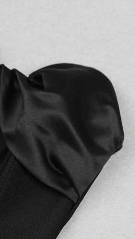 BLACK STRAPLESS JUMPSUIT WITH TIERED RUFFLE HEM