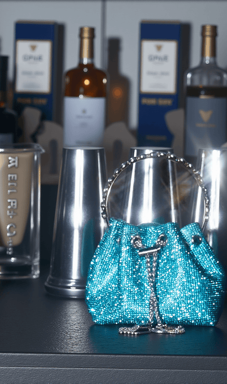 Mattea Crystal Embellished Bucket Bag In Blue