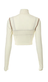 High-necked long-sleeved suspender top.