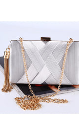 Silk clutch with tassel pendant.