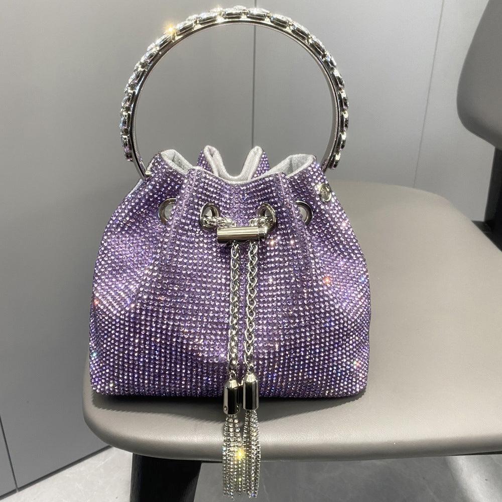 AIIZIE CRYSTAL EMBELLISHED BUCKET BAG IN PURPLE - product image