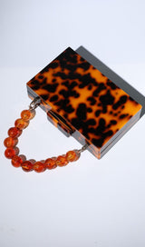 ACRYLIC BEADED CLUTCH IN AMBER