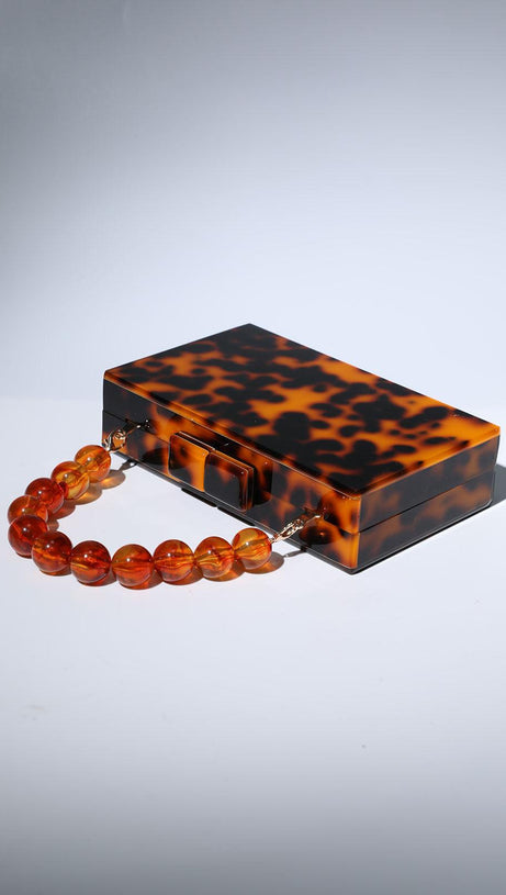 ACRYLIC BEADED CLUTCH IN AMBER