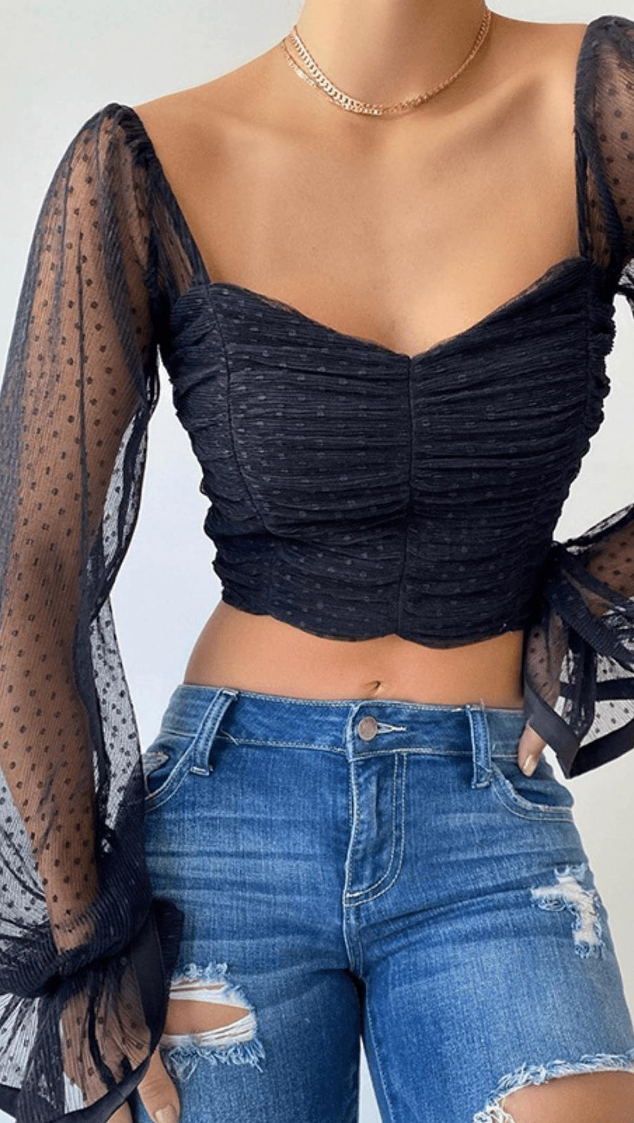 TOP CORTO CON SENO AVVOLGENTE A POIS NERO