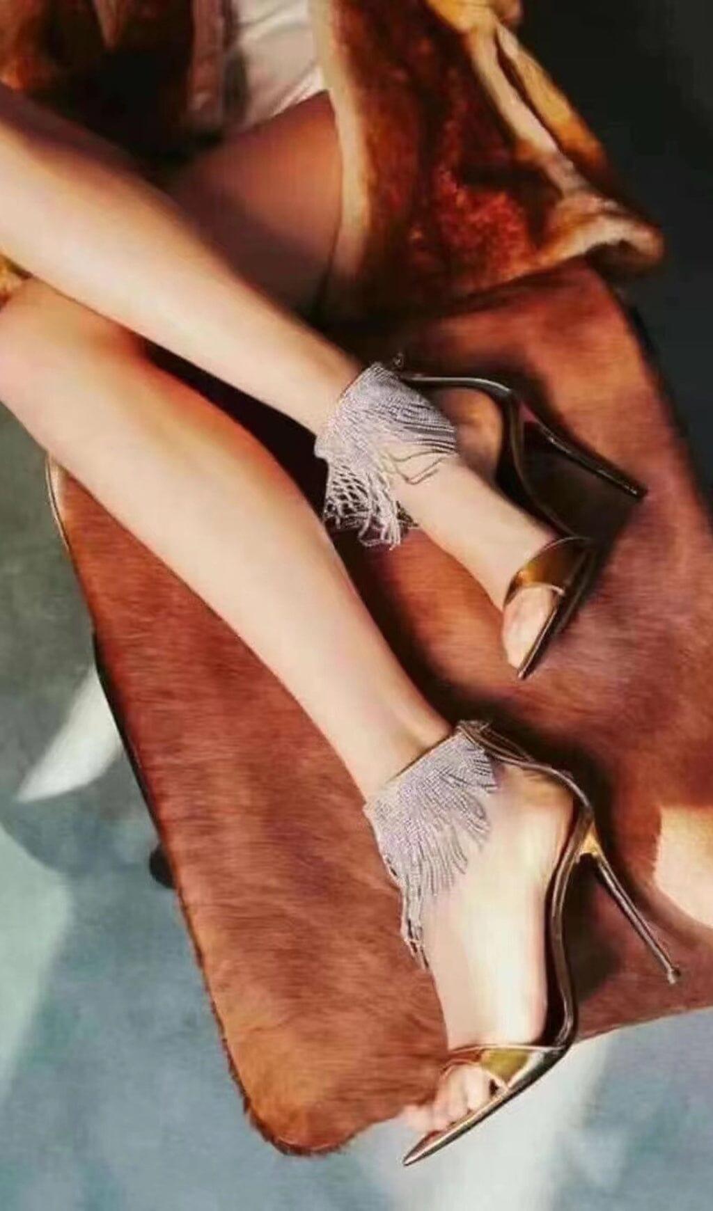 DÉCOLLETÉ CON NAPPINE DI CRISTALLI IN ORO